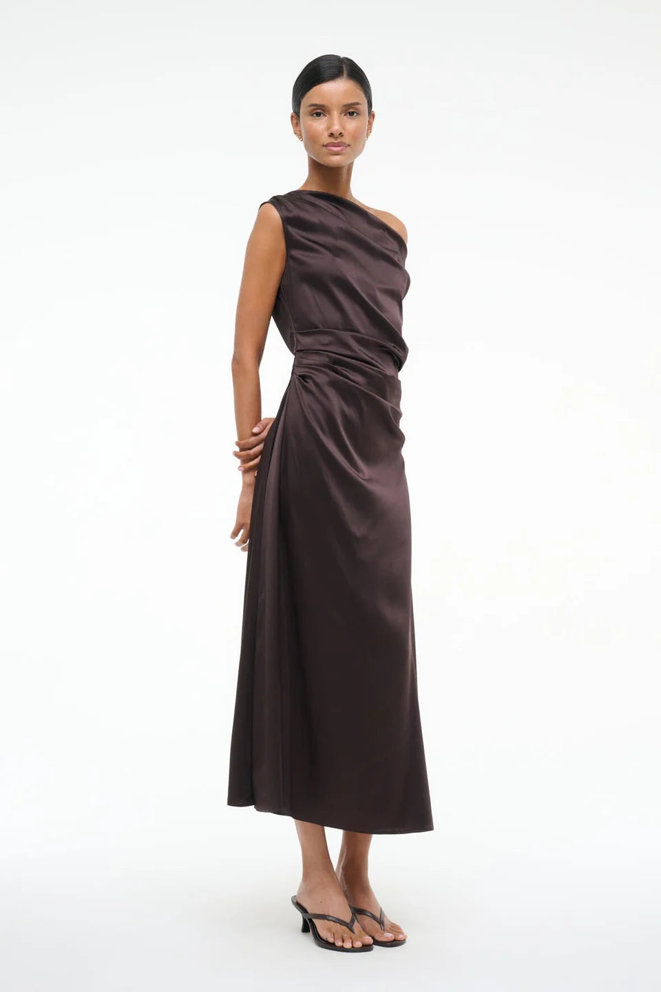 Close-up of the Staud Phare Dress in Earth highlighting the luxurious stretch silk fabric.