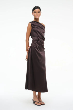 Close-up of the Staud Phare Dress in Earth highlighting the luxurious stretch silk fabric.