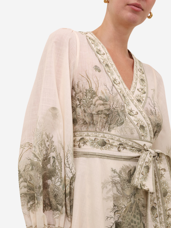 Model wearing the Wanderlust Wrap Midi Dress in Khaki Toile styled with accessories for a chic summer look.