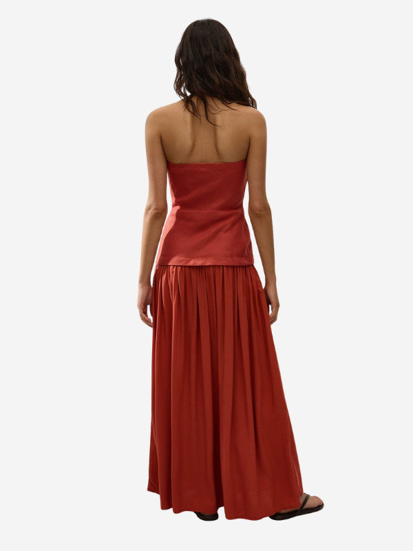 Hedy Maxi Dress in Dusty Tomato styled with sandals, perfect for occasionwear.