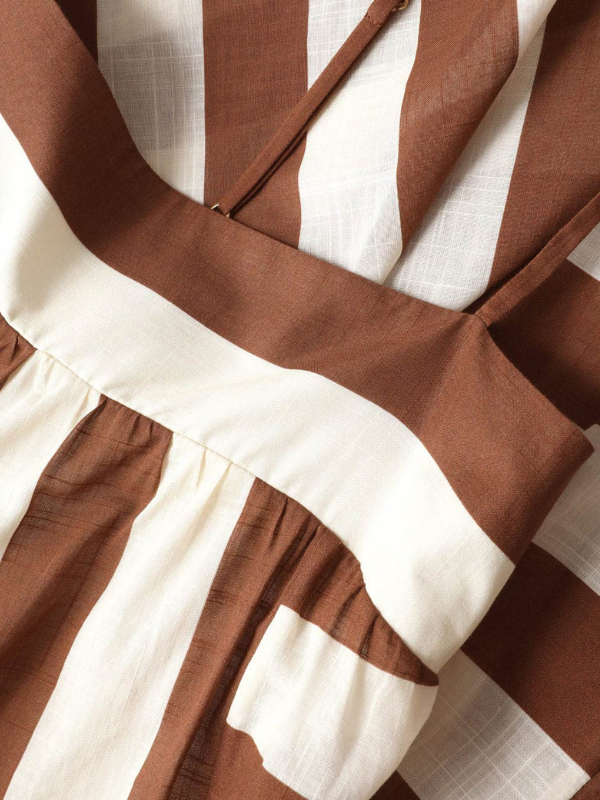 The Daylight Stripe Maxi Dress in Choc/Cream Stripe displayed on a mannequin, emphasizing its stylish design.