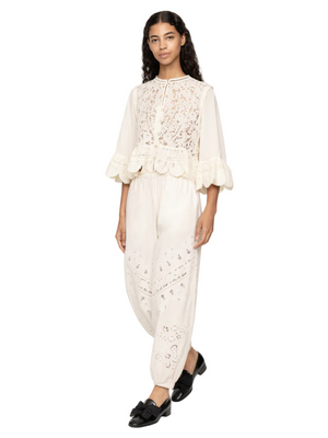 Close-up of the Shanna Lace Top in Cream highlighting the delicate crocheted metal chain details.