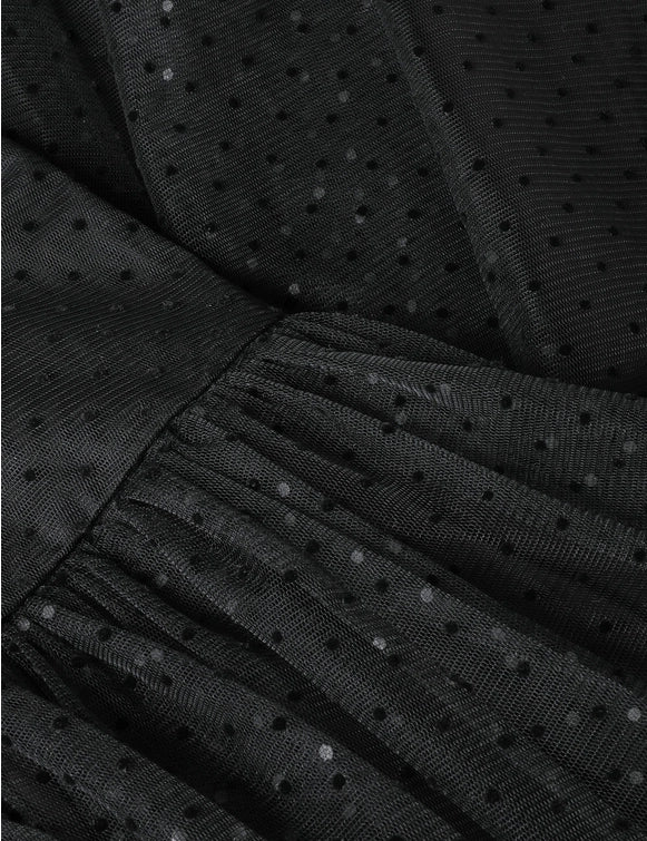 Model wearing the Tulle Dot Midi Skirt in Black styled with a chic top, demonstrating its versatility and elegance by Zimmermann.