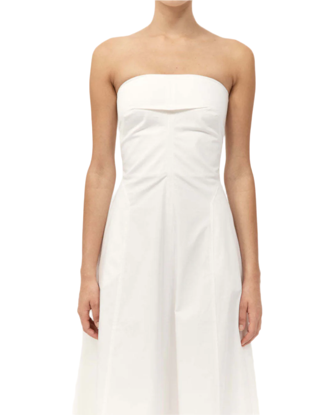 Side view of the Sculpted Cotton Strapless Dress in Milk emphasizing the side seam pockets.