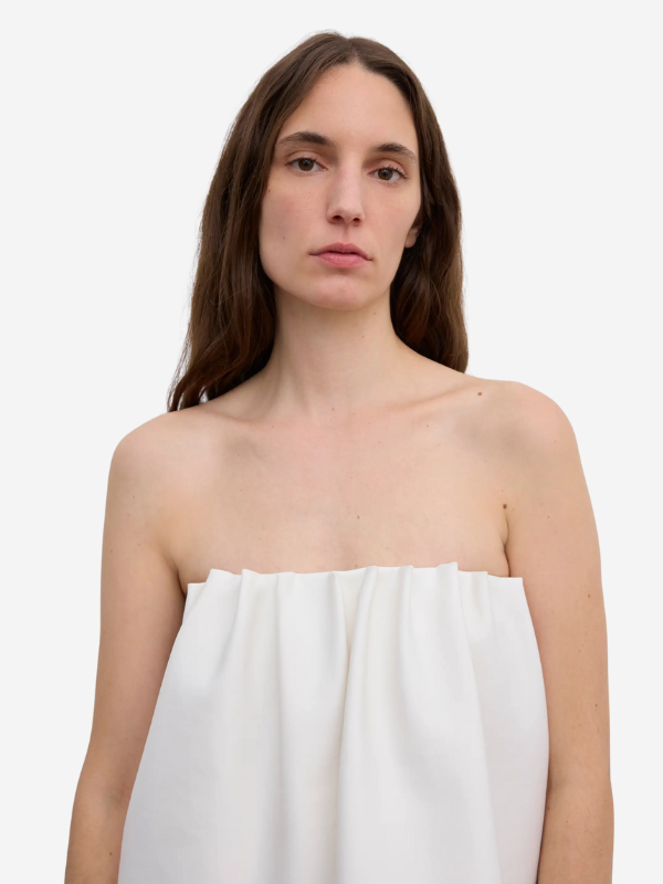 Back view of the Rouched Tube Top in White by House of Dagmar, featuring a concealed zipper for a sleek look.