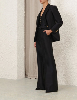 Flat lay of Hypnotic Flare Pant in Black, demonstrating the high-quality wool blend and luxurious fabric texture.