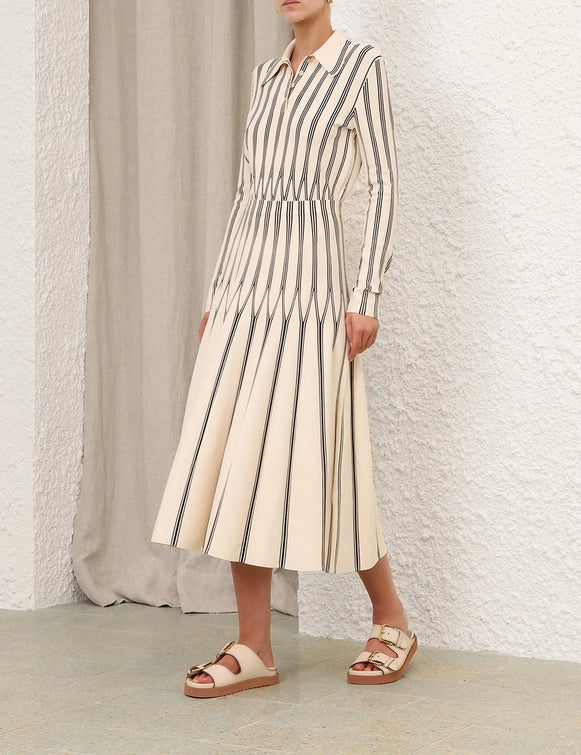 Full length view of the Rebellion Striped Midi Skirt in Cream Stripe styled with a casual top for a relaxed look.