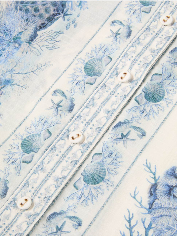 Lifestyle shot of the Wanderlust Body Shirt in Blue Toile, perfect for resort wear from Zimmermann's 2026 collection.