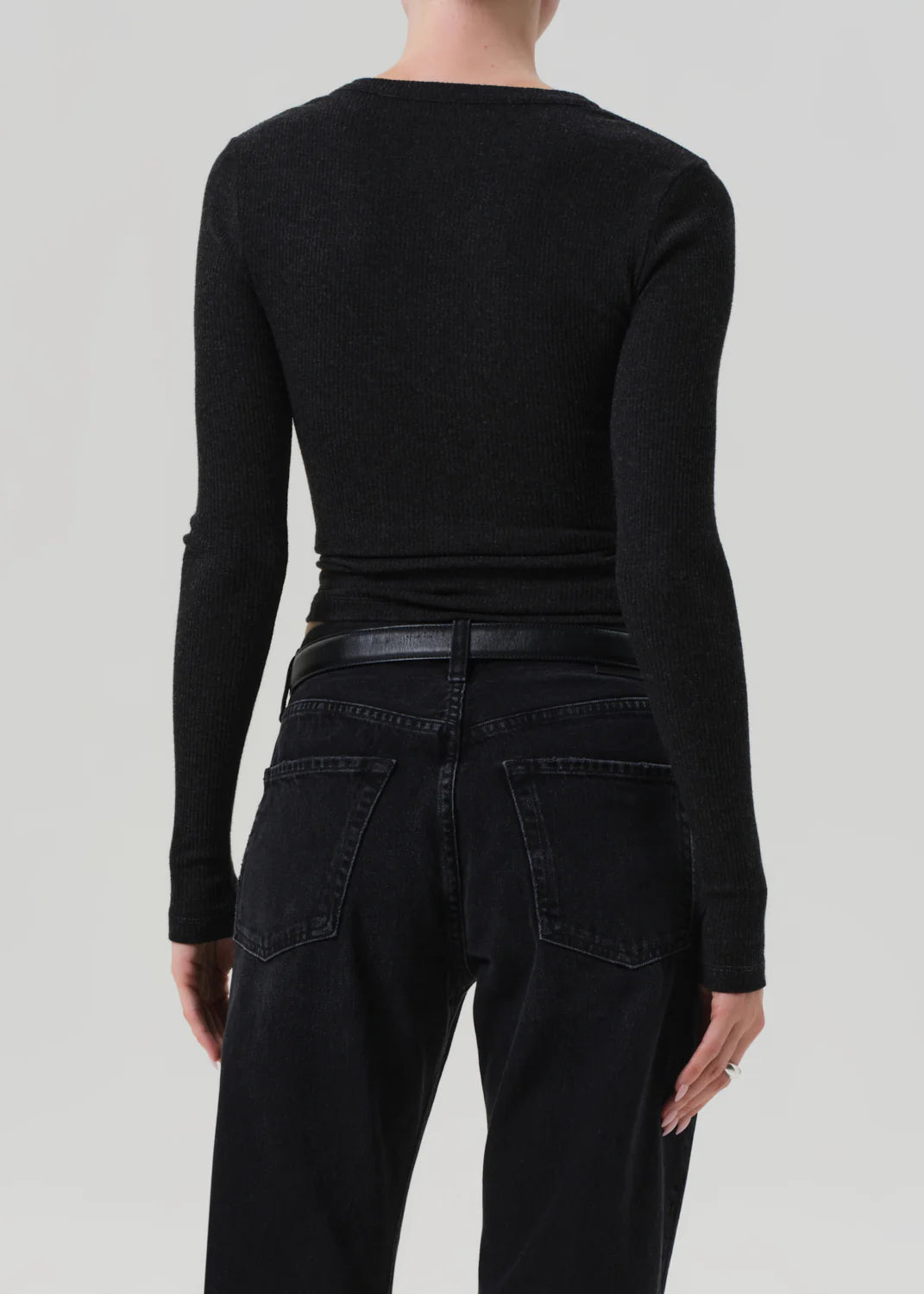 Bina Crewneck in Heather Charcoal displayed on a mannequin, emphasizing its long sleeve silhouette and casual style.