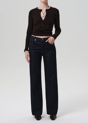 Close-up of the neckline detailing on the Vara Henley in Chocolate, highlighting its modern design