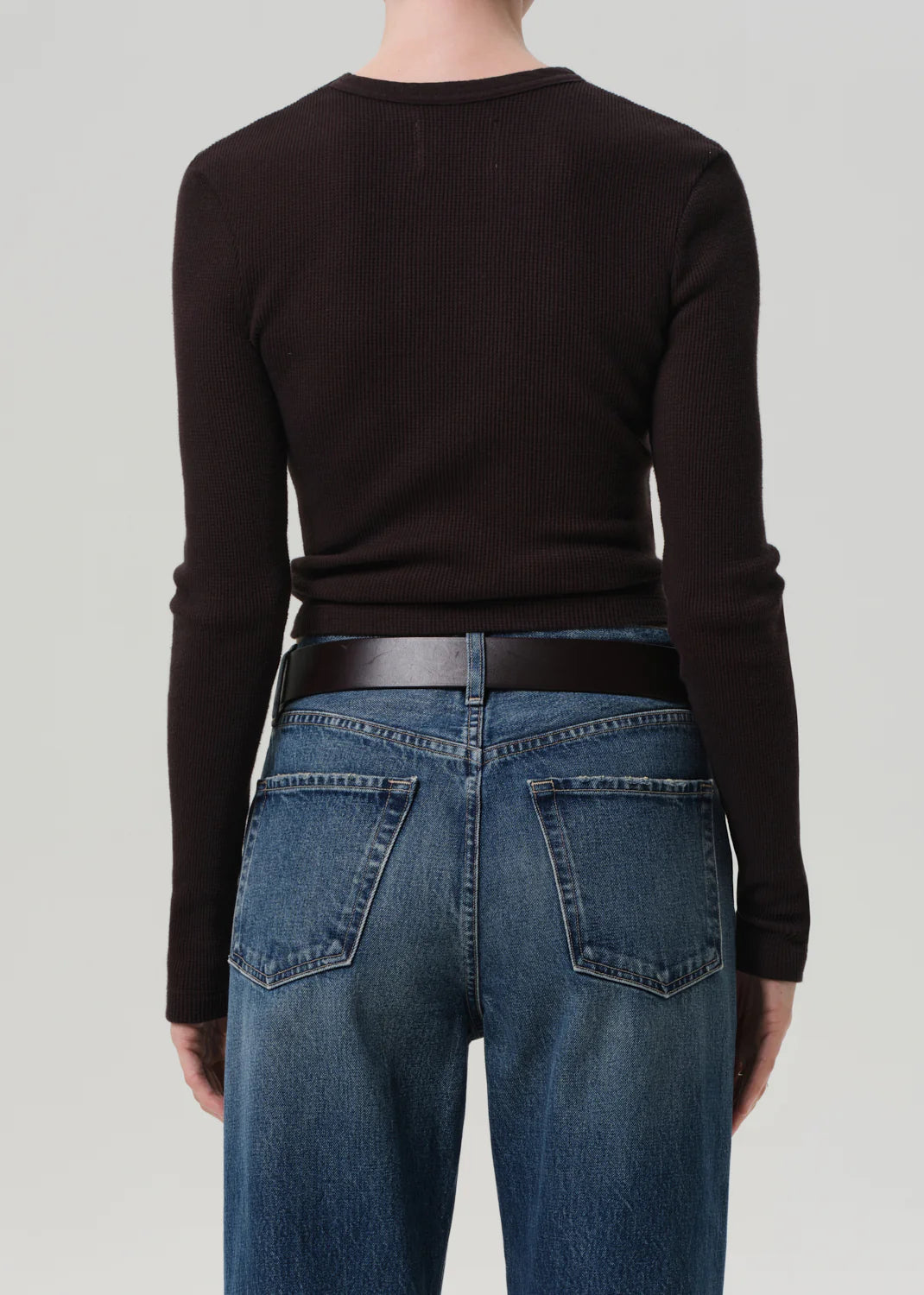 Pilar Waffle Crewneck in Chocolate styled with denim, illustrating its versatility as a go-to everyday layer.
