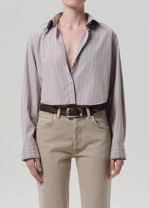The Ana Shirt in Noble Stripe displayed on a hanger, highlighting its lightweight cotton fabric.