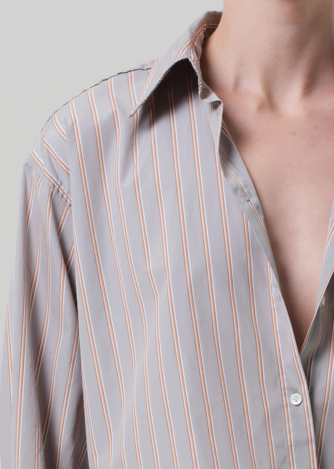 Back view of the Ana Shirt in Noble Stripe, emphasizing its stylish cropped design and breathable cotton.