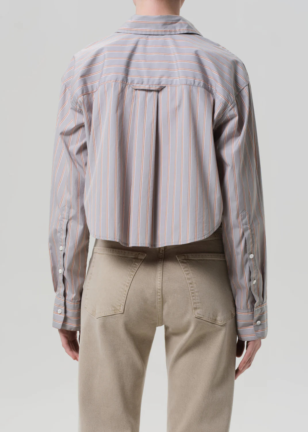 Model wearing the Ana Shirt in Noble Stripe by Citizens of Humanity, featuring a modern shape and breathable cotton.