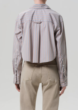 Model wearing the Ana Shirt in Noble Stripe by Citizens of Humanity, featuring a modern shape and breathable cotton.