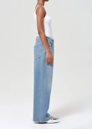Model wearing Agolde Vana Fold Jean in Mantra styled with a simple white tee