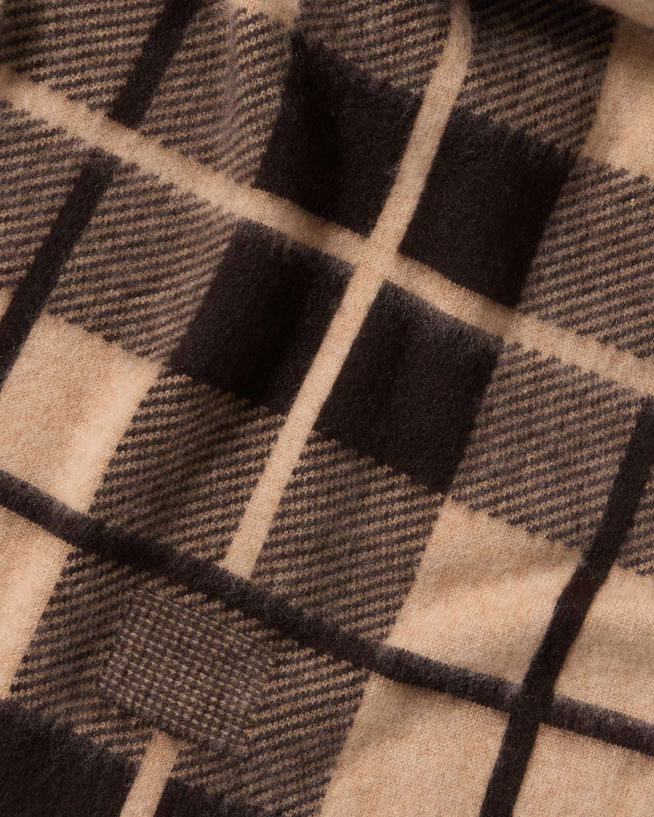 Model wearing the Plaid Big Scarf in Burnt Cocoa/Dune, demonstrating its versatility and blend of 70% Wool and 30% Cashmere.