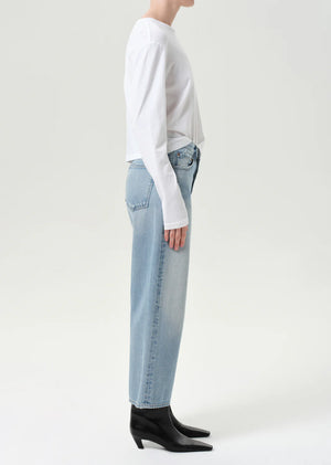 Close-up of the button fly closure and soft cotton hand feel of Agolde's Arc Jean in Orten.