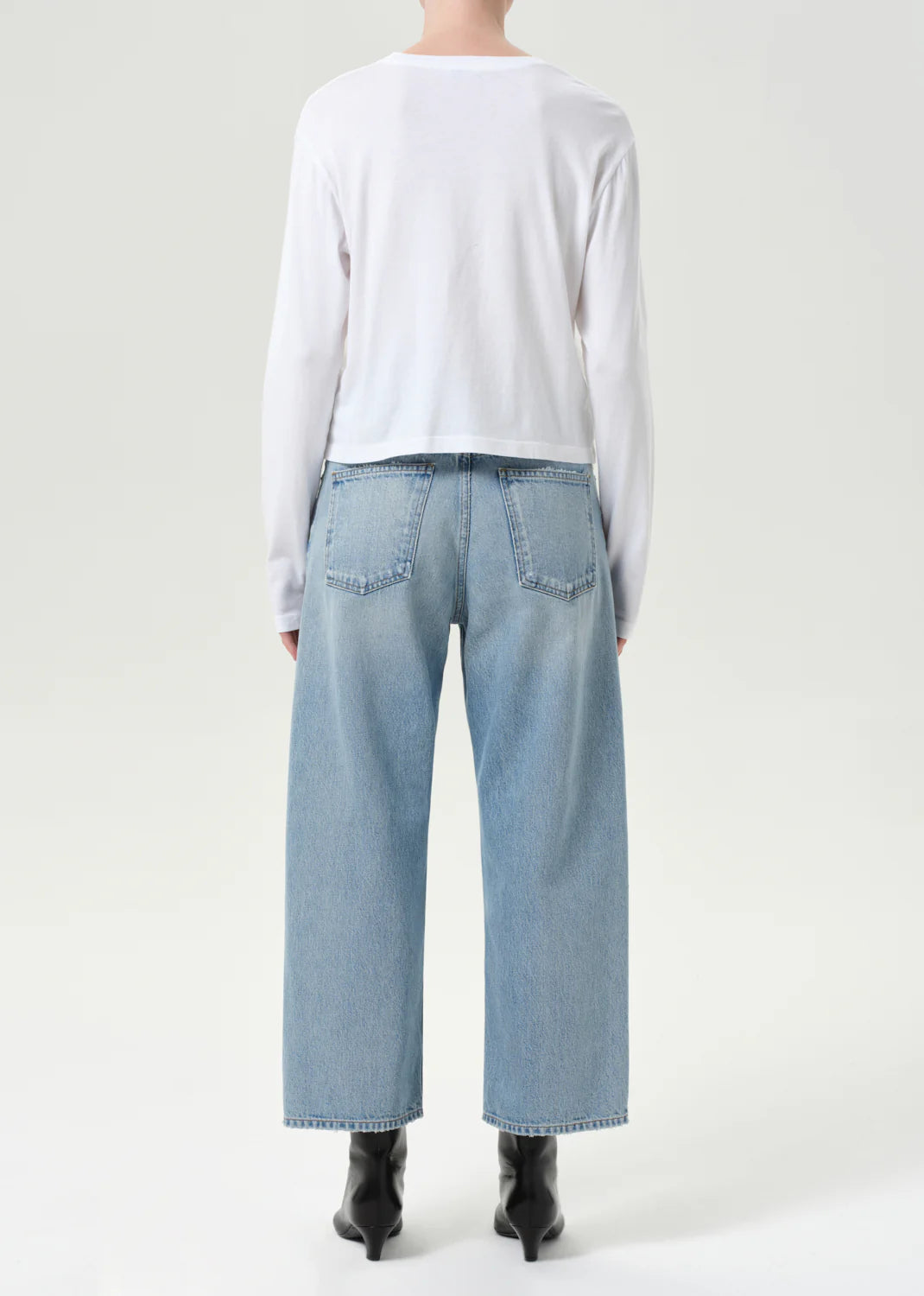 Side view of Agolde Arc Jean in Orten, emphasizing the unique shape and stylish design.