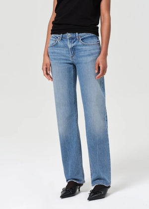 Back view of Agolde Low Rise Slim Stretch jeans in Kindle with a focus on the stylish outline and leg opening.