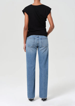 Close-up of Agolde Low Rise Slim Stretch jeans zipper fly detail in Kindle, emphasizing the high-quality craftsmanship.