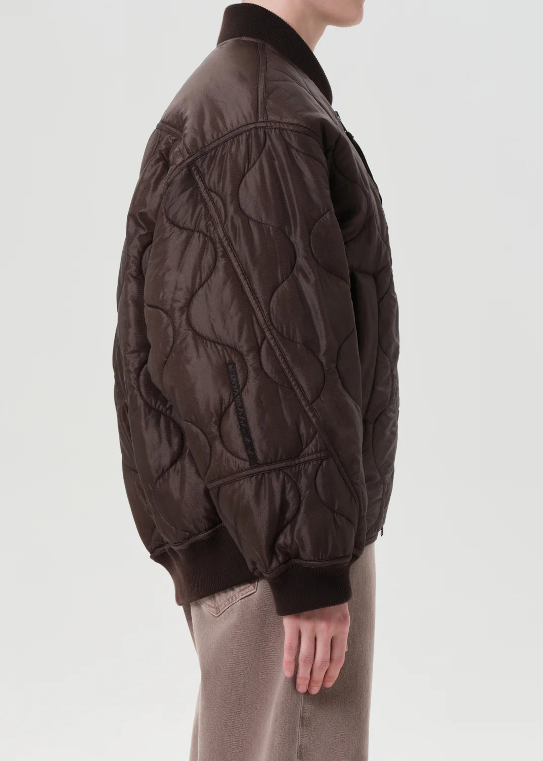Isla Quilted Jacket in Bourbon styled with denim for a casual winter look.