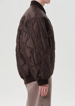 Isla Quilted Jacket in Bourbon styled with denim for a casual winter look.