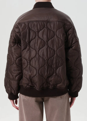 Back view of the Isla Quilted Jacket in Bourbon showing subtle volume through the sleeves.