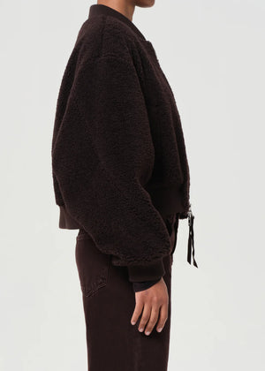 Back view of the Iona Skye Jacket in Chocolate demonstrating its cropped silhouette and voluminous sleeves.