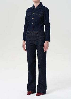 Close-up of Agolde Contoured Jacket in Rinse, highlighting the shaping seams and denim texture.