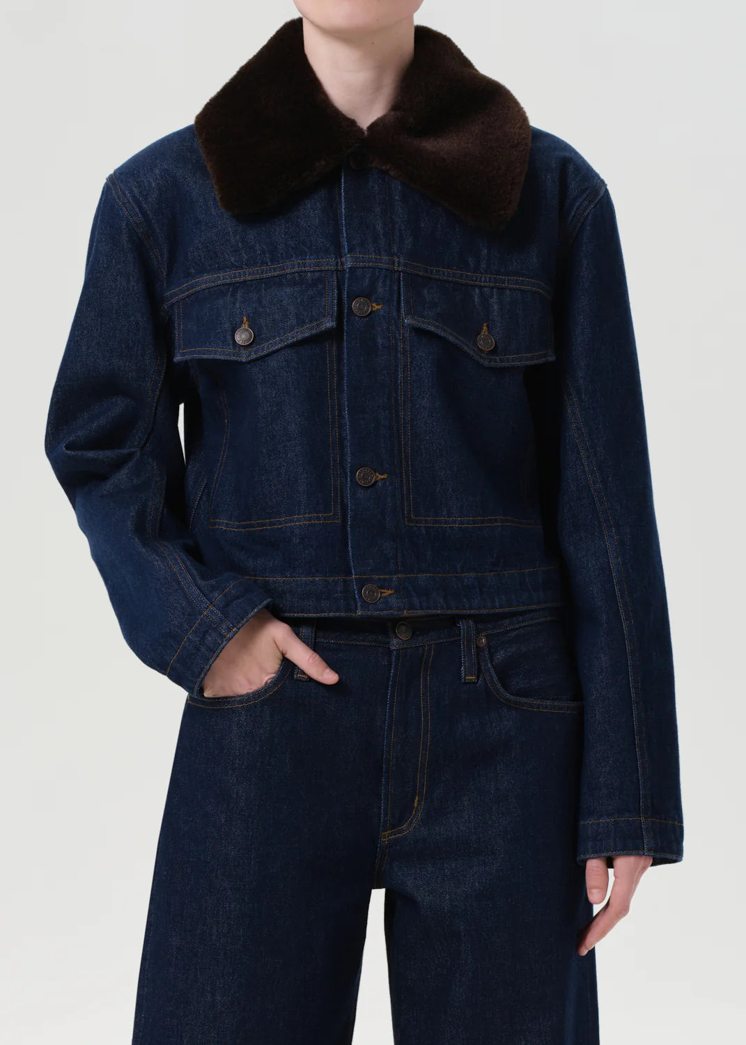 Side view of the Agolde Walker Jacket with Fur in Rinse demonstrating its stylish silhouette and versatile design.