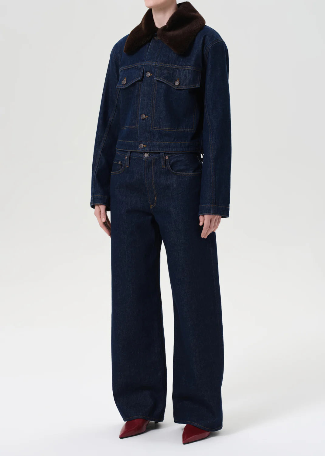 Close-up of the Agolde Walker Jacket with Fur in Rinse highlighting the dark rinse color and soft faux fur detail.