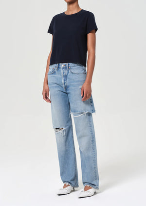 Stylish Adine Tee in Storm, perfect for layering with denim shorts or jeans.