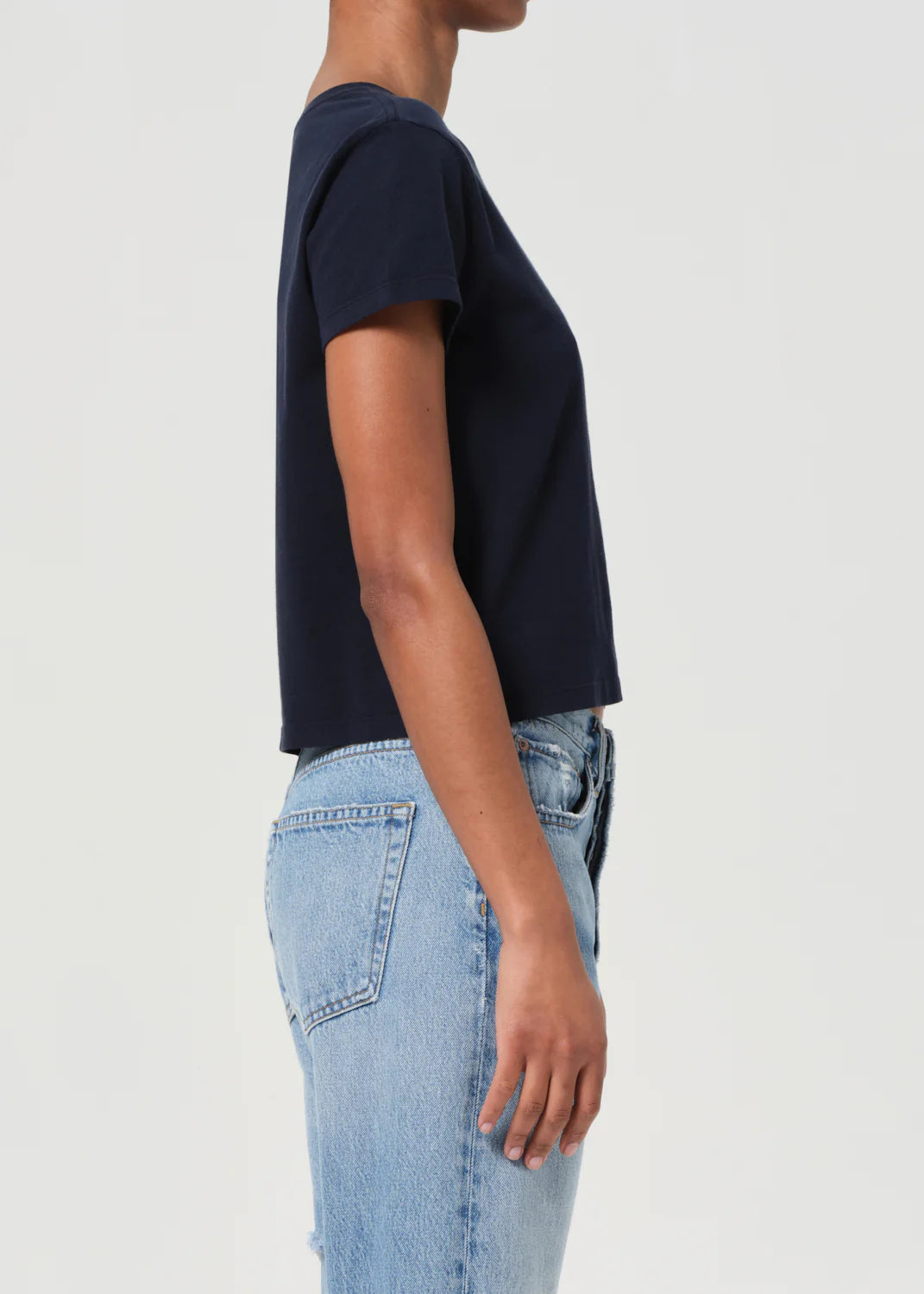 Lifestyle shot of the Adine Tee in Storm, demonstrating versatility in casual wear.