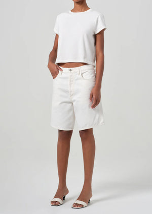 Close-up of Agolde's Adine Shrunken Tee in White Ash, highlighting the texture of the organic cotton.