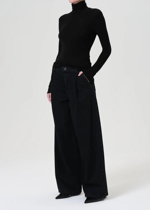 Side view of the Agolde Pascale Turtleneck in Black, designed for versatile styling.