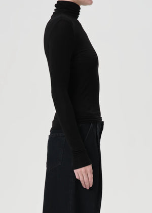 Close-up detail of the fabric texture of the Agolde Pascale Turtleneck in Black.