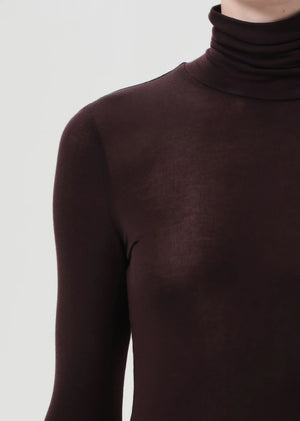 Casual look featuring the Pascale Turtleneck in Root, a must-have piece for any wardrobe.