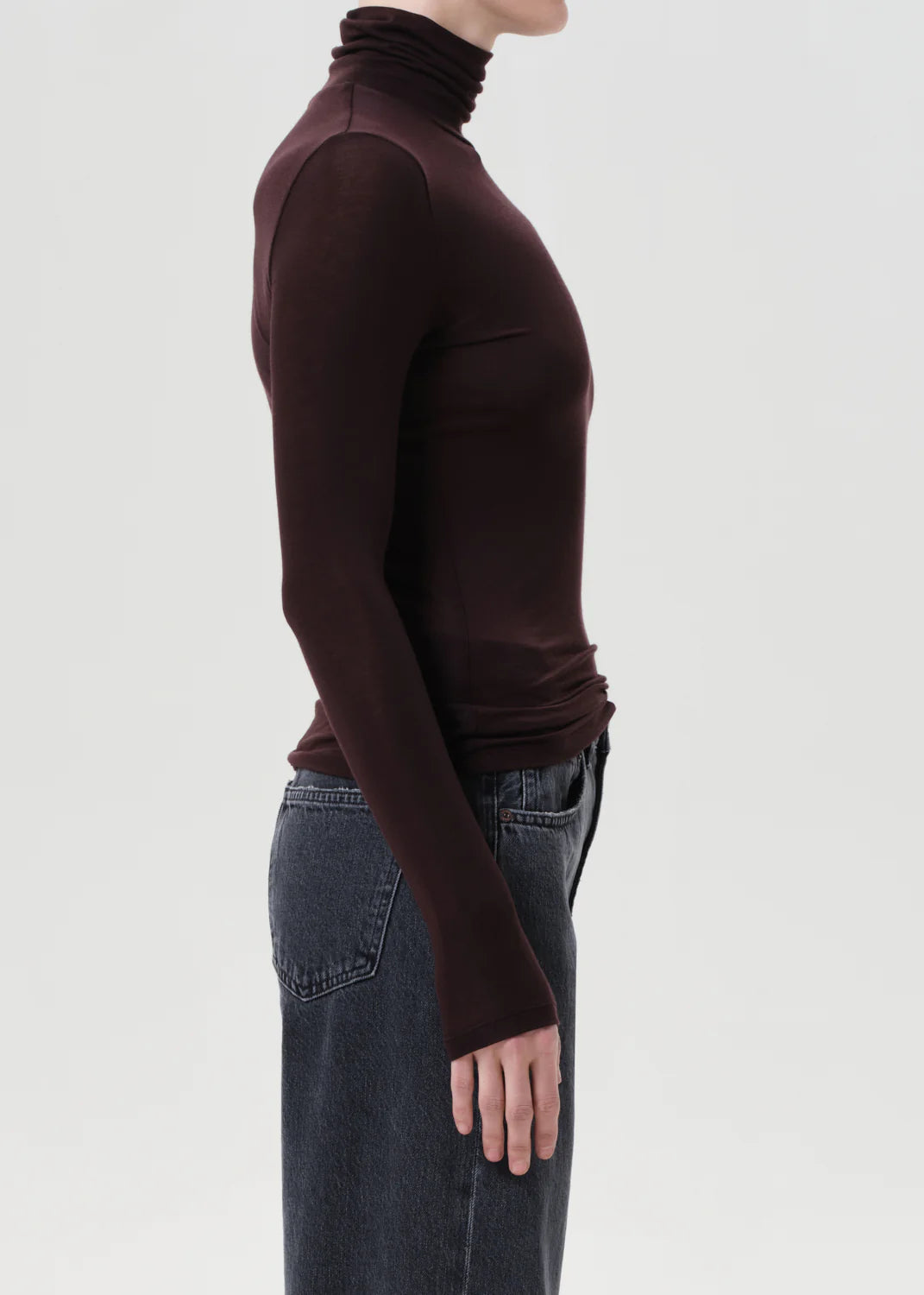 Model wearing the Pascale Turtleneck in Root, illustrating its flattering fit and versatile style.