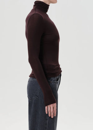 Model wearing the Pascale Turtleneck in Root, illustrating its flattering fit and versatile style.