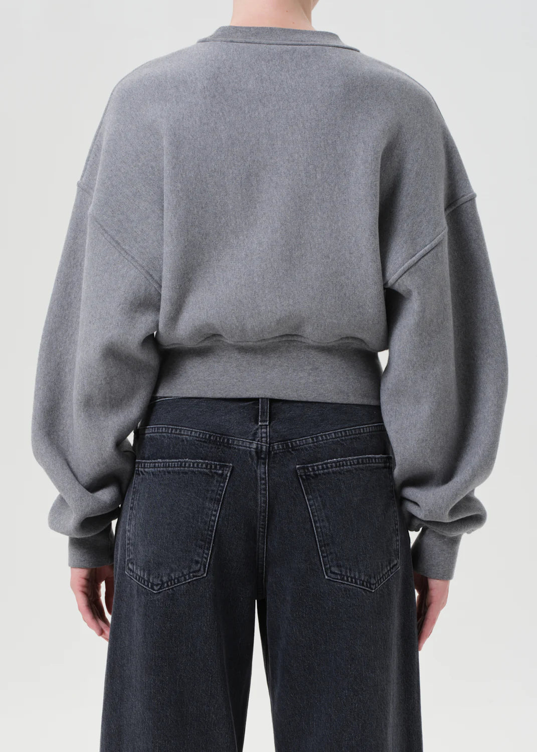 Back view of the Kit Sweatshirt in Heather Grey, featuring its cropped length and modern shape.