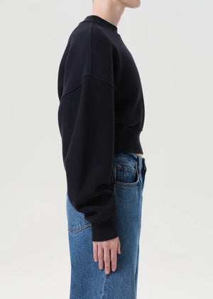 Back view of the Kit Sweatshirt in Mirage, highlighting the cinched shape and elasticated hem.