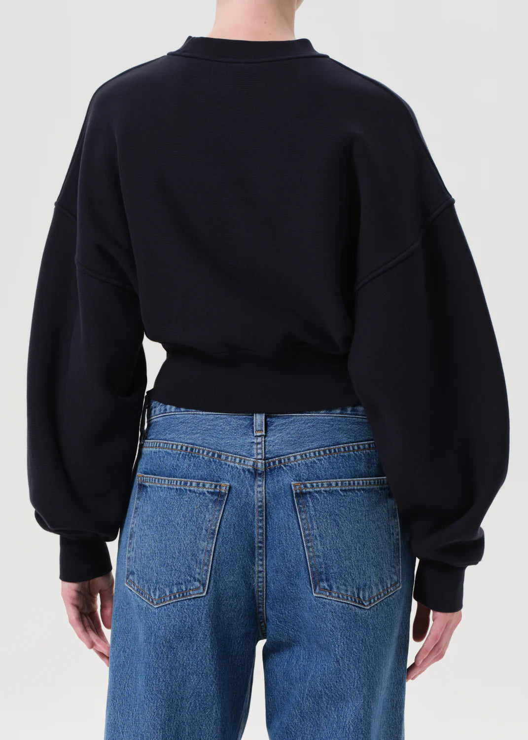 Flat lay of the Kit Sweatshirt in Mirage, showcasing its breathable cotton fleece texture and rich color.