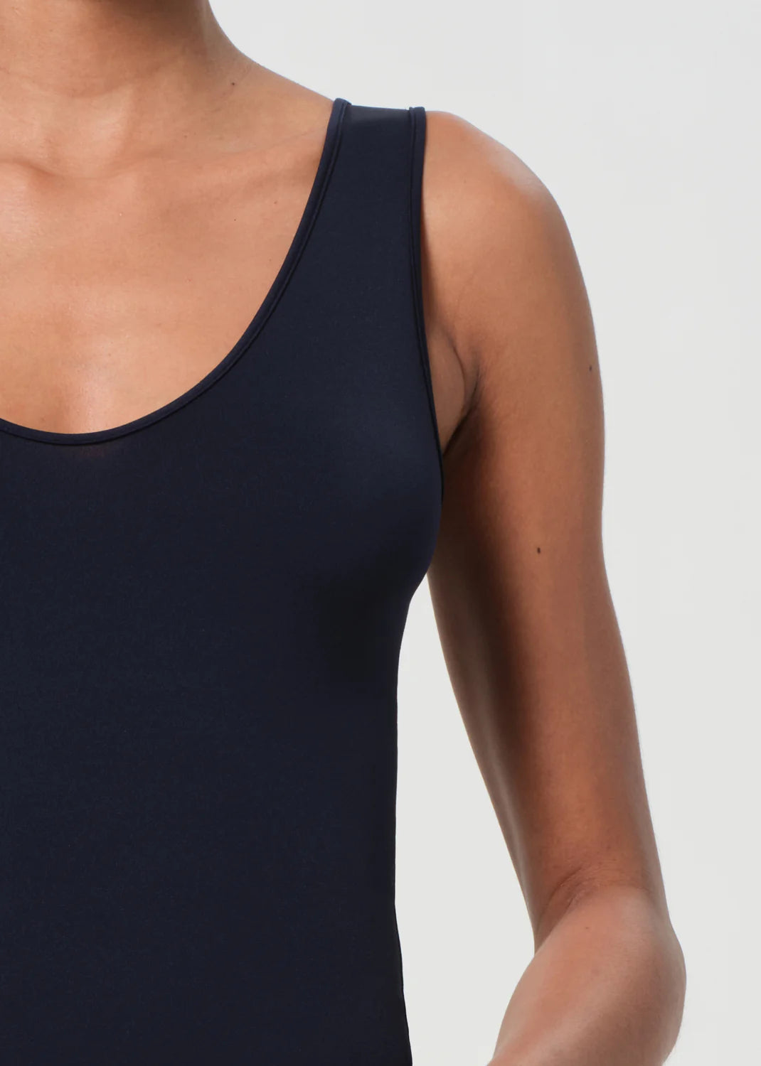 Back view of the Agolde Tora Bodysuit in Mirage, illustrating its seamless design ideal for various outfits.
