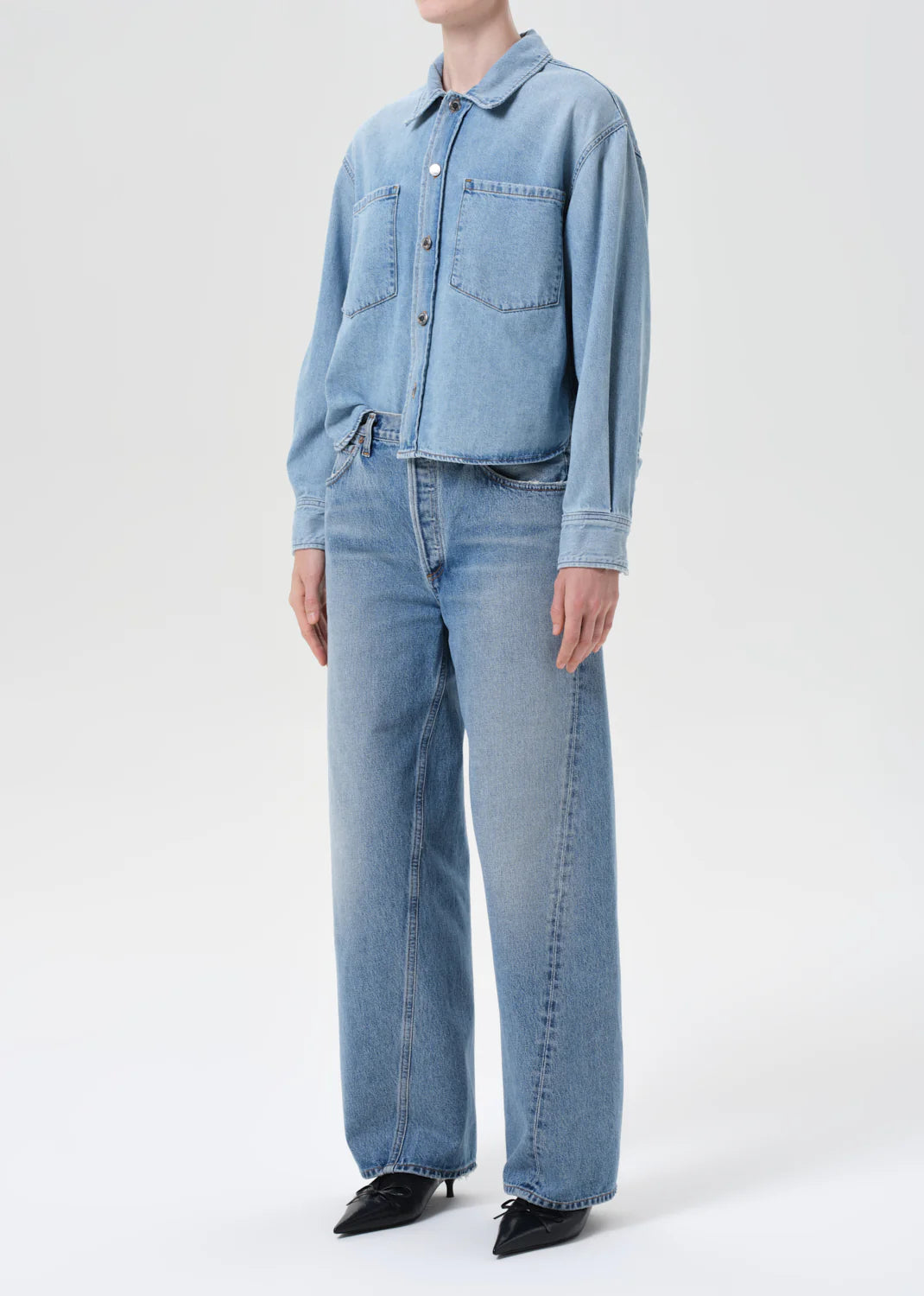 Close-up of the Juna Shirt in Interval, highlighting the bright washed indigo denim fabric and button-up design.