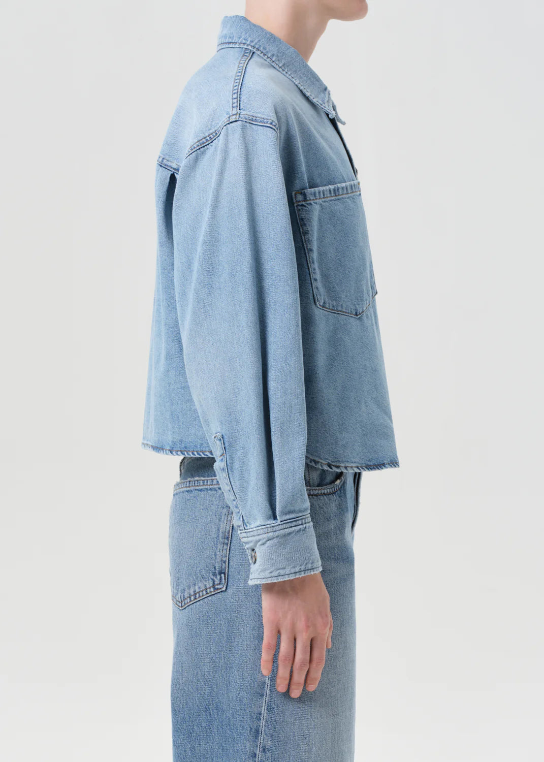 Back view of the Juna Shirt in Interval, featuring its relaxed fit and breathable denim material.