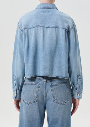 Flat lay of the Juna Shirt in Interval by Agolde, showcasing its soft, non-stretch denim and patch pockets.