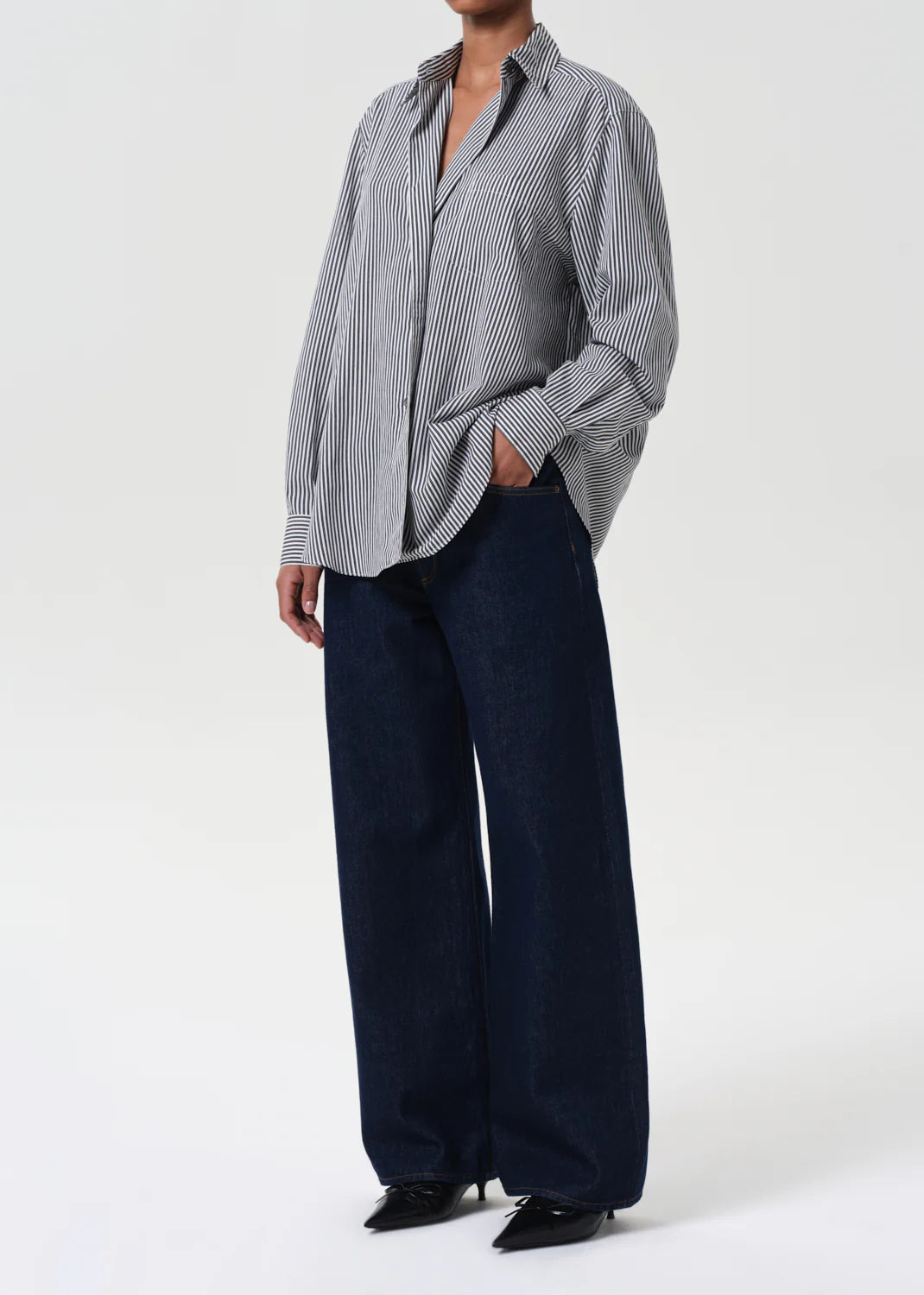 Close-up of the Agolde Aris Shirt in Solene Stripe fabric, featuring a lightweight black-and-white striped pattern.