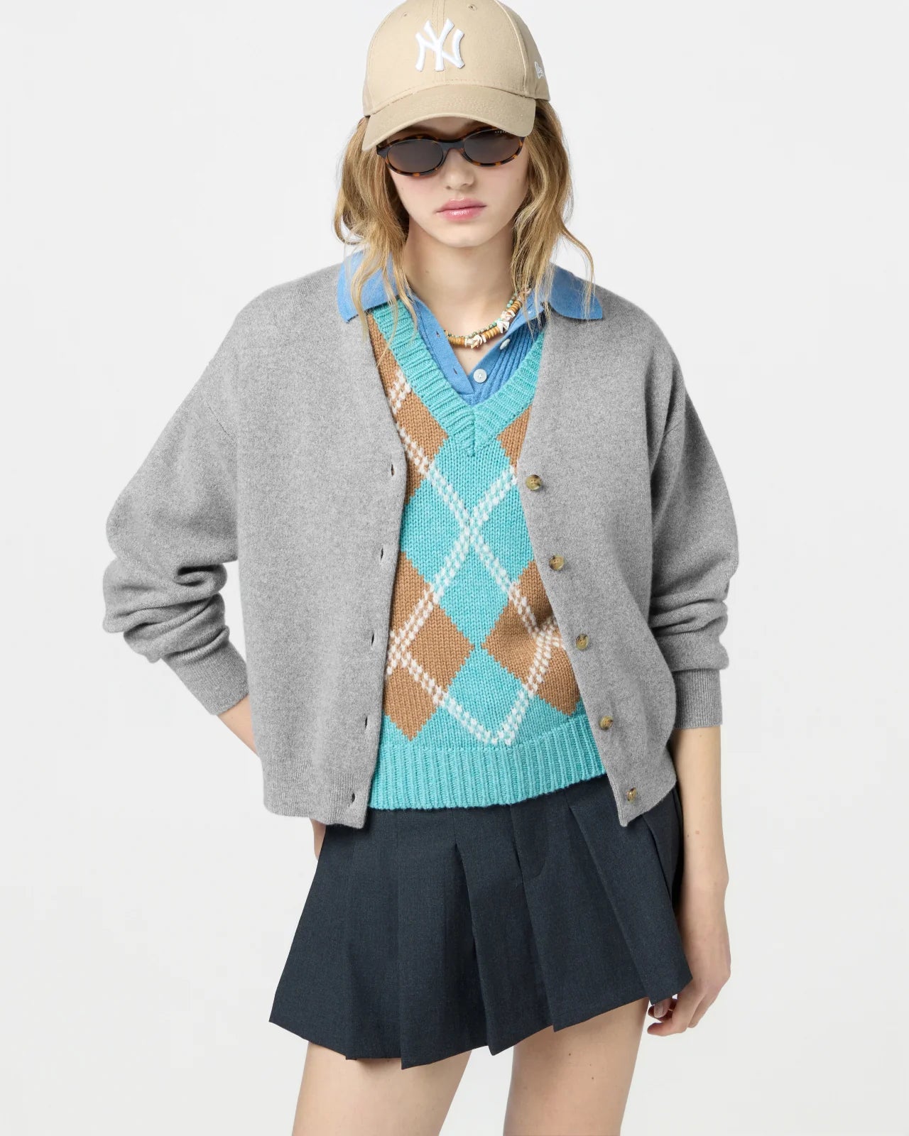 Detailed flat lay of the Collegiate Cardigan in Heather Grey, emphasizing the 100% cashmere composition.