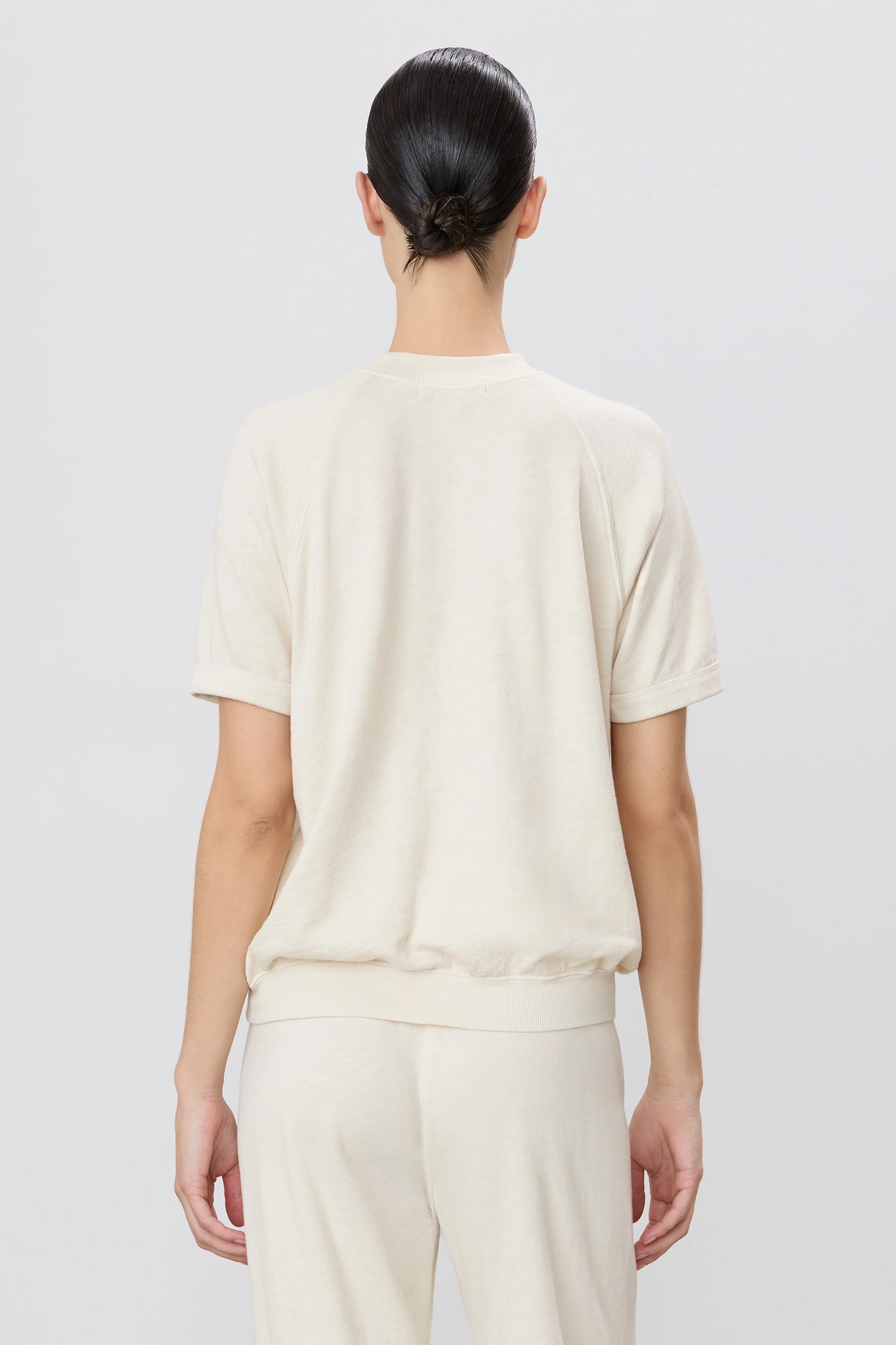 Versatile Short Sleeve Raglan Sweatshirt in Bone, designed by Éterne, highlighting a modern silhouette and comfortable fit, underscoring the keyword short sleeve sweatshirt.